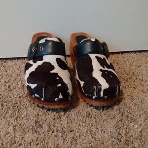 Black and white cow print clog shoes
